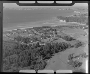 Orewa, Rodney County, Auckland, including coastline, housing and pine trees
