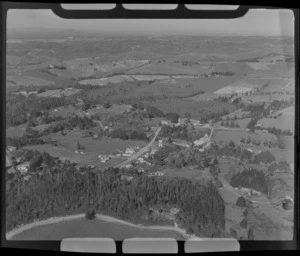Silverdale, Rodney District, Auckland, including houses and pine trees