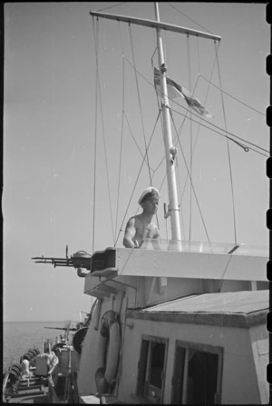 Lieutenant Commander G T McCarthy on bridge of a World War II naval motor launch in the Adriatic - Photograph taken by George Bull