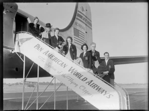 Unidentified group of New Zealand representatives boarding Pan American World Airways NC88944, Clipper Express aircraft