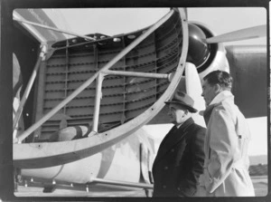Bristol Freighter Tour, portrait of (L to R) James Sawers (General Manager for NZR) and M F Elliot (Bristol Sales Representative) in front of Bristol Freighter transport plane 'Merchant Venturer' G-AIMC while being loaded, Paraparaumu Airport, North Wellington Region