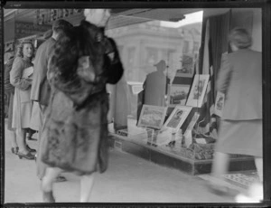 Unidentified people viewing Hallenstein Brothers shop window, a display of BOAC (British Overseas Airways Corporation) photographs, Auckland