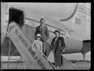 Mr Parker and family, next to aircraft Douglas DC-4 Clipper Racer, PAWA (Pan America World Airways), unidentified location