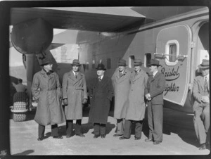Bristol Freighter Tour, group portrait of NZ NAC personnel (L to R) R Gardiner, J Foley, F Maurice Clarke (General Manager), J Jennings, T O'Connell by side loading door of Bristol Freighter transport plane 'Merchant Venturer' G-AIMC, Paraparaumu Airport, North Wellington Region