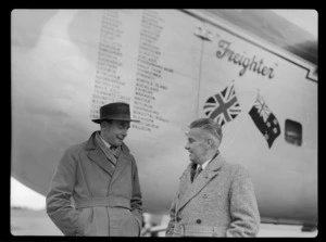 Bristol Freighter Tour, portrait of (L to R) M Harvey (Club Captain, Canterbury) and John [Stannage?] in front of Bristol Freighter transport plane 'Merchant Venturer' G-AIMC, [Christchurch Airport, Canterbury Region?]