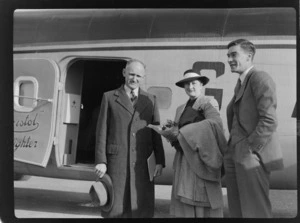 Bristol Freighter Tour, portrait of (L to R) Mr & Mrs J Newman (Mrs Newman is sister to L L Thomas) and Mr M F Elliott (Bristol Sales Representative) on arrival from Nelson on Bristol Freighter transport plane 'Merchant Venturer' G-AIMC at Paraparaumu Airport, North Wellington Region