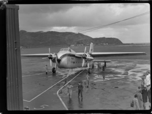 Bristol Freighter Tour, view of unidentified people with Bristol Freighter transport plane 'Merchant Venturer' G-AIMC at Rongotai Airport, Wellington City