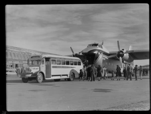 Bristol Freighter Tour, view of luggage being unloaded from front cargo bay of Bristol Freighter transport plane 'Merchant Venturer' G-AIMC into an NAC Midland Bus, Harewood Airport, Christchurch City