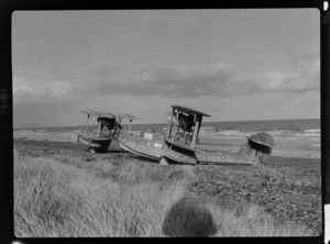 Bristol Freighter Tour, view of two RNZAF Supermarine Walrus Mk I Seaplanes ('K' NZ157 in front) owned by J M Gould on a Paraparaumu Beach, North Wellington Region