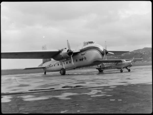 Bristol Freighter Tour, view of an Auster J/1 Autocrat ZK-APO plane in front of Bristol Freighter transport plane 'Merchant Venturer' G-AIMC, Rongotai Airport, Wellington City