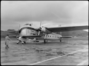 Bristol Freighter Tour, view of an Auster J/1 Autocrat ZK-APO plane in front of Bristol Freighter transport plane 'Merchant Venturer' G-AIMC, Rongotai Airport, Wellington City