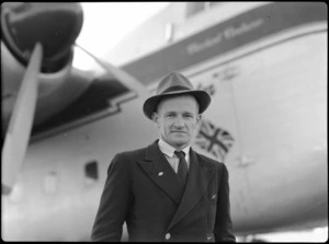 Portrait of Mr FJ Lucas, ex-Wing Commander, in front of Bristol Freighter transport aeroplane