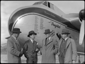 Group of men alongside a Bristol Freighter transport aeroplane 'Merchant Venturer', showing from left to right; Mr Todd, B Todd (Chairman Airport Committee), Mr FW Furkett (Wellington City Council and former chief engineer PWD), and Mr R Luke (Wellington City Council engineer)