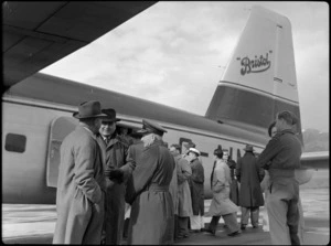 Group of unidentified men embarking Bristol Freighter transport aeroplane G-AIMC, Rongotai Airport, Wellington
