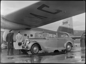 The vice-regal car parked alongside a Bristol Freighter transport aeroplane at Rongotai Airport, Wellington, during inspection by Governor-General Bernard Freyberg, including chauffeur and other unidentified men
