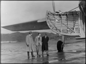 Governor-General Sir Bernard Freyberg, Mr Ellison, and Mr Puttick, inspecting Bristol Freighter transport aeroplane 'Merchant Venturer', Rongotai Airport, Wellington