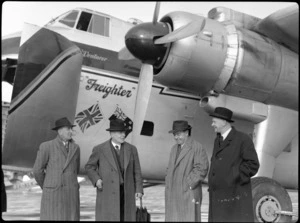 Group of men standing alongside Bristol Freighter transport aeroplane 'Merchant Venturer', showing, from left to right; ER Toop (Wellington city council) B Todd (chairman, Airport Committee), Mr FW Furkett, (city council), and Ken Luke (city engineer), at Rongotai Airport, Wellington