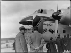 Group inspecting Bristol Freighter transport aeroplane 'Merchant Venturer', showing the Governor-General Sir Bernard Freyberg speaking to an unidentified man, at Rongotai Airport, Wellington