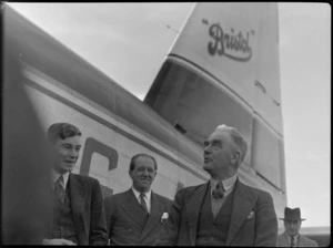 Mr Elliot, Mr Higgs and Mayor of Masterton Mr W Kemp, alongside Bristol Freighter transport aeroplane 'Merchant Venturer', [at Hood Aerodrome?] Masterton