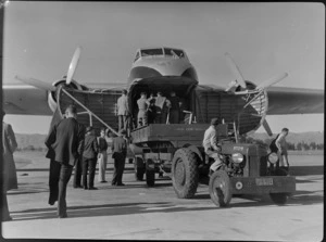 Bristol Freighter transport aeroplane 'Merchant Venturer' being loaded at Woodbourne Aerodrome, Marlborough District