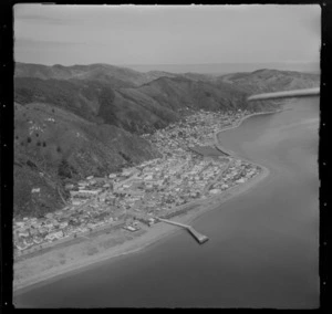 View south over the Lower Hutt Valley suburb of Eastbourne with Rona Bay and wharf, Muritai Primary School and Wellington Harbour