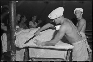 Cutting the loaves for baking at the 2 New Zealand Field Bakery in Italy during World War II - Photograph taken by George Kaye