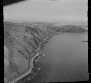 View of State Highway 1 road and railway line south to the coastal settlement of Pukerua Bay and Porirua Basin beyond, Wellington Region