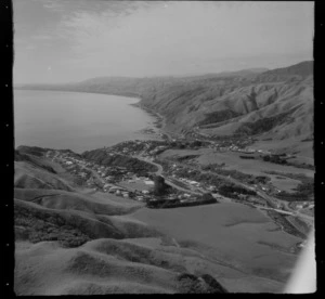 View north over Pukerua Bay coastal settlement with Pukerua Bay School and State Highway 1 to the Kapiti Coast beyond, Porirua District, Wellington Region