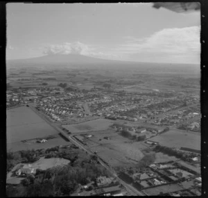 The town of Hawera with Manawapou Road and Hawera Primary School, looking to farmland and Mount Taranaki beyond