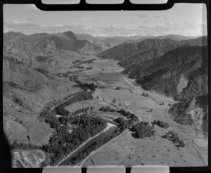 Rural area, including an aircraft topdressing a field and Owen River that connects to Buller River, near Murchison, Tasman region