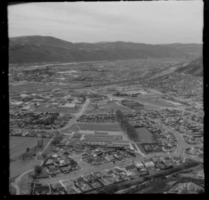 The suburb of Naenae with Waddington Drive in foreground looking to Naenae Olympic Pool and Railway Station with Avalon beyond, Lower Hutt, Wellington Region