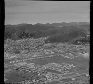 View to the suburb of Naenae with Naenae College in foreground and railway station beyond, Lower Hutt Valley, Wellington region