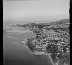View south over the Wellington City suburbs of Hataitai and Evans Bay Parade Road with wharves and marina, to Kilbirnie, Melrose and Lyall Bay beyond