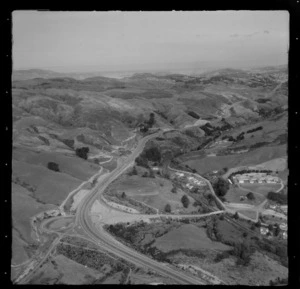 View of the Porirua-Johnsonville Motorway and the Takapu Road turnoff to the northern suburb of Tawa with Arohata Women's Prison, to Johnsonville and Wellington Harbour beyond