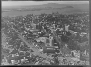 Auckland City, including the YMCA building in the foreground and Rangitoto Island in the background