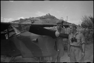 J S Patterson and N J Seymour examine observation aircraft near Riccione, Italy, World War II - Photograph taken by George Kaye