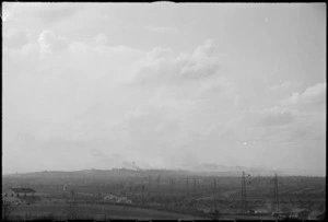 Smoke rising from Rimini, Italy, as it is bombarded from land, sea and air in World War II - Photograph taken by George Kaye
