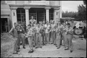 Informal group outside Headquarters of 22 NZ Battalion near Rimini, Italy, World War II - Photograph taken by George Kaye