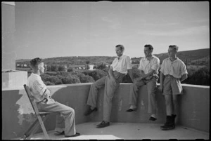 Patients from surgical wards at 1 New Zealand General Hospital relax on balcony, Italy, World War II - Photograph taken by George Kaye