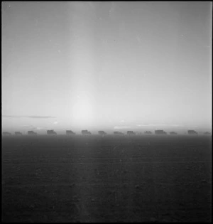 World War II New Zealand convoy moving out at dusk from Wadi ZemZem, Libya - Photograph taken by H Paton