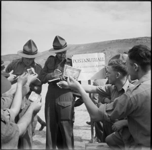 Bookmakers take bets at race meeting organised by 36 New Zealand Survey Battery in Trans Jordania, World War II - Photograph taken by M D Elias