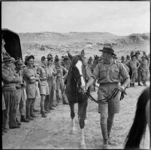 Parade of horses at race meeting organised by 36 New Zealand Survey Battery in Trans Jordania, World War II - Photograph taken by M D Elias