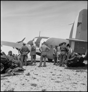 Transferring wounded to air ambulance during World War II, Tunisia - Photograph taken by H Paton
