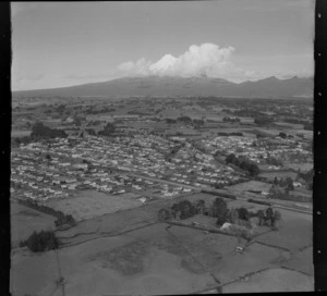 View over Inglewood with Mountain Road in foreground to Rimu Street through town, to farmland and Mount Taranaki beyond