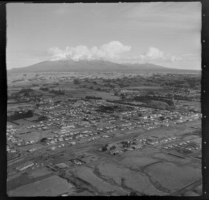 View to the farming town of Stratford with Broadway Street and railway station to farmland and Mount Taranaki beyond