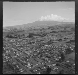 View over the farming town of Eltham with Kegworth Street and the Eltham Bowling Club in foreground, to farmland and Mount Taranaki beyond