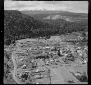 View of the town of Ohakune with Ohakune Railway Station and the Mangawhero Terrace road in the foreground to Mount Ruapehu in cloud beyond, Manawatu-Whanganui Region