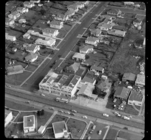 Mt Roskill/Onehunga area, Auckland, including the premises of a business/factory advertising 'The Home of Parisian Coats', and rows of houses