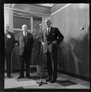 Sir Leonard Isitt and unidentified men at National Airways Corporation opening