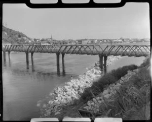 Whitebaiting at Greymouth, includes railway bridge, river and township.